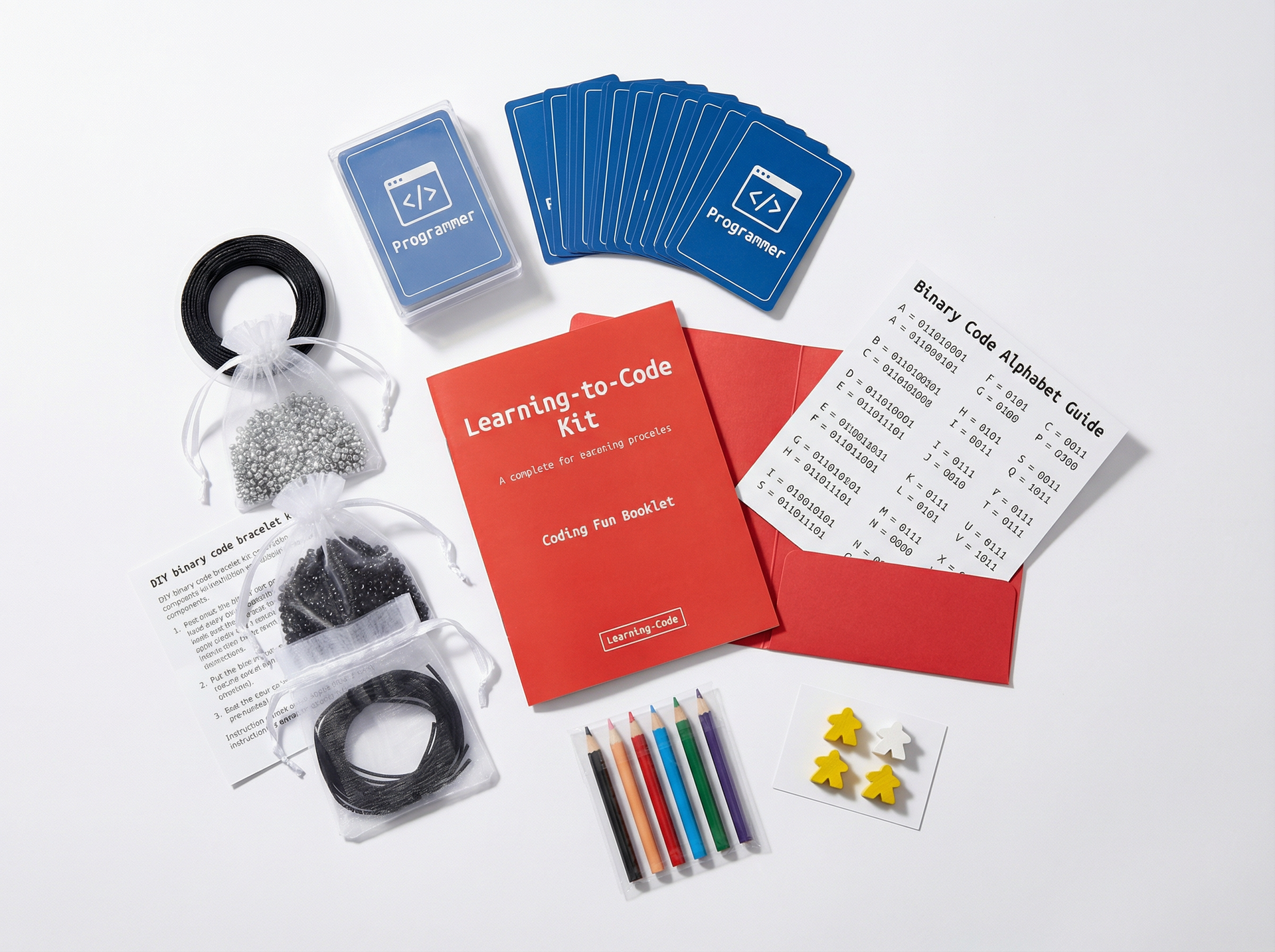 Learning-to-code kit with books, cards, and coding materials on a white background